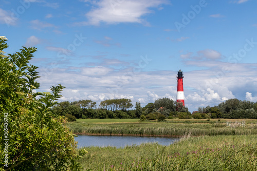 lighthouse (1907 AD) and blue sky on Pellworm Island, Germany