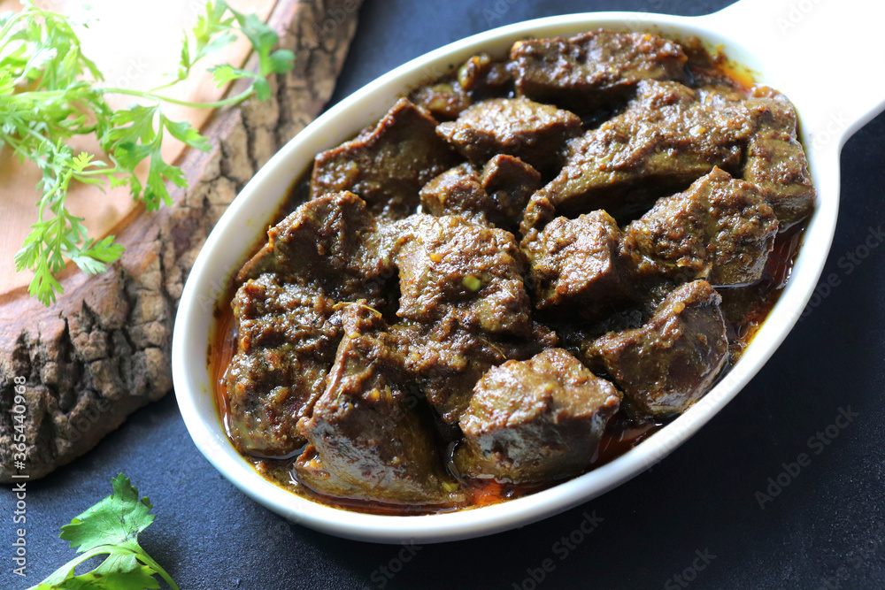 Mutton Liver Masala or goat Kaleji fry, garnished with coriander ...