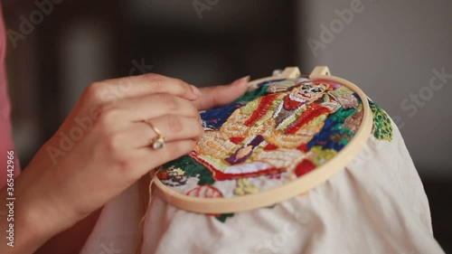 Woman doing traditional indian embroidery