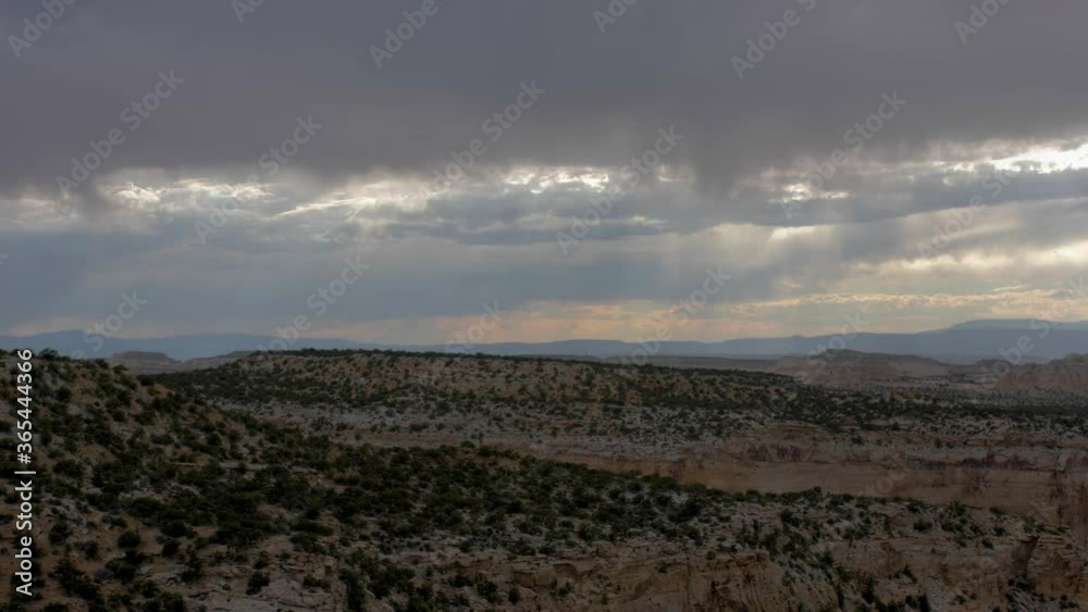 Zoom pan shot of desert canyon overlooking rock formations and mesa Zoom pan shot of desert canyon overlooking rock formations and mesa