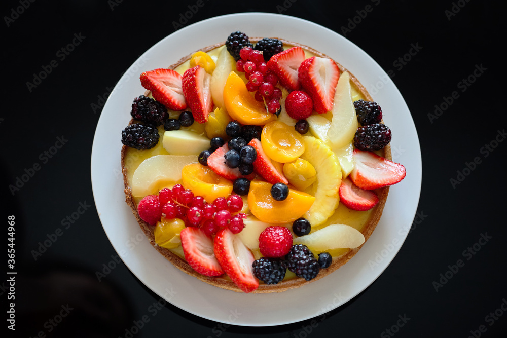 Fresh Fruit cake on a black background Fresh Fruit cake on a black background