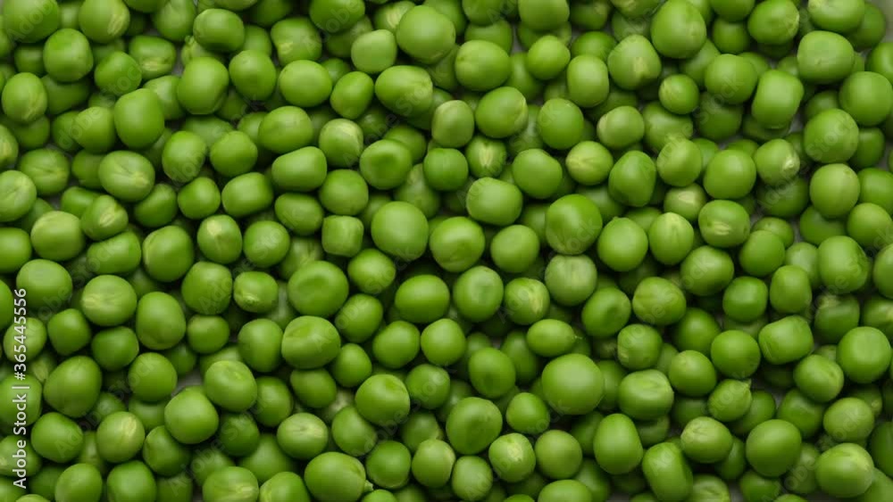fresh green peas rotating close up, top view fresh green peas rotating close up, top view