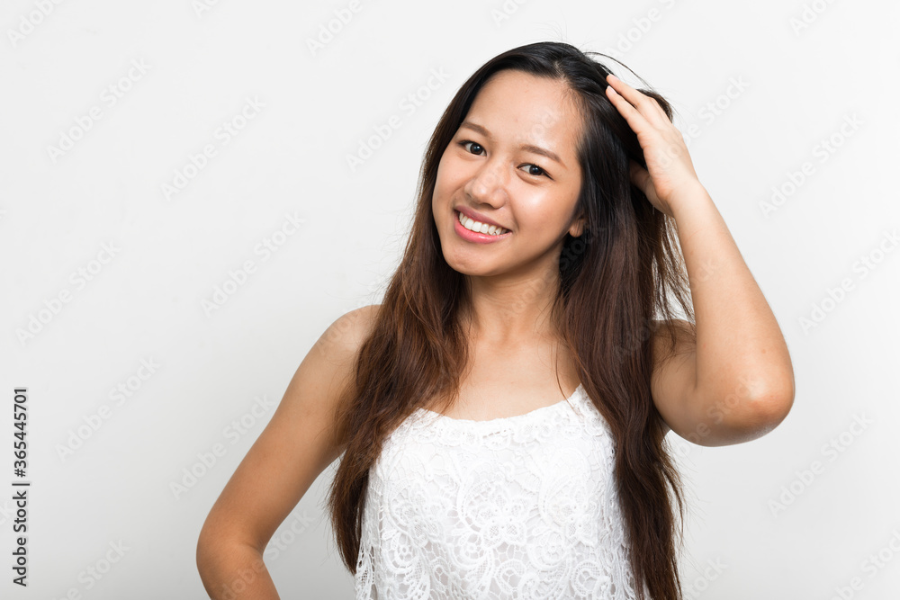 Portrait of happy young beautiful Asian woman Portrait of happy young beautiful Asian woman