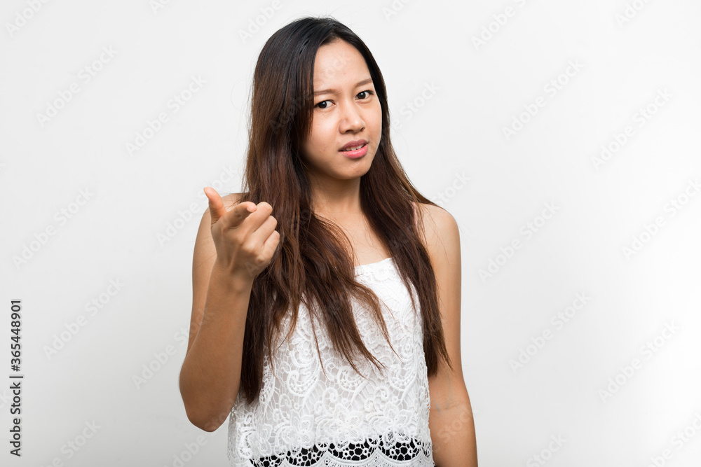Studio shot of young beautiful Asian woman Studio shot of young beautiful Asian woman