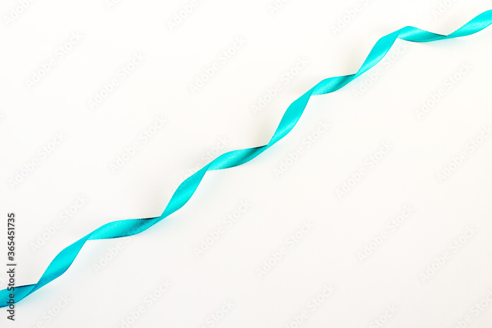Silk ribbon. Decorative element isolated on a white background. Close-up. Silk ribbon. Decorative element isolated on a white background. Close-up.