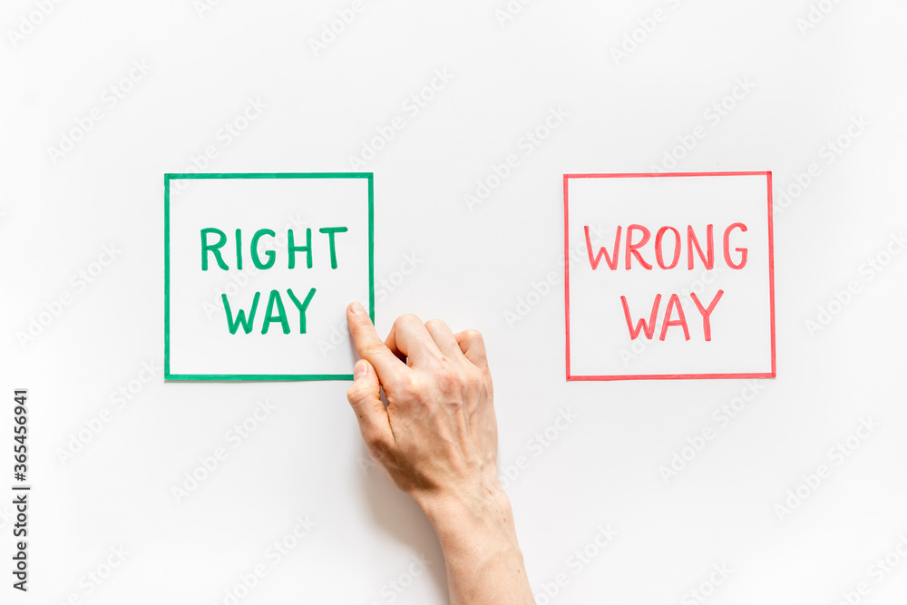 Choice concept. Right and wrong way icons, female hands shows top view