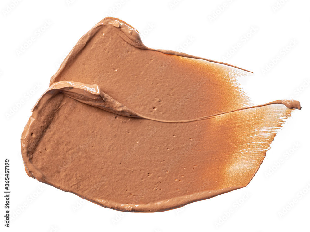 Smudged stain of a cream foundation isolated on white Smudged stain of a cream foundation isolated on white