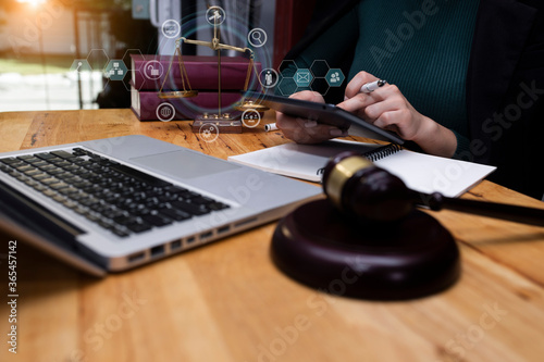 Concepts of Law and Legal services. Lawyer working with digital tablet computer at office.