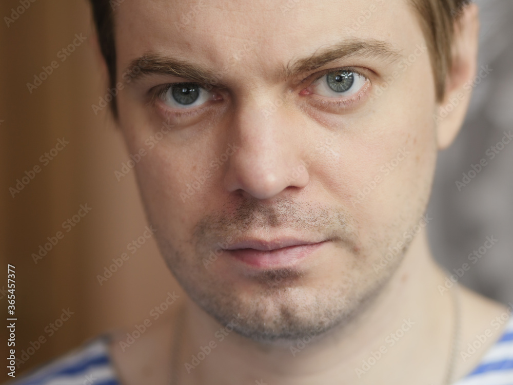 Fototapeta premium Portrait of pensive man with short hair and no retouch.