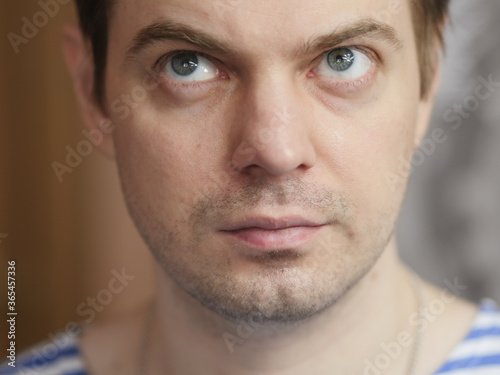 Portrait of pensive man with short hair and no retouch.