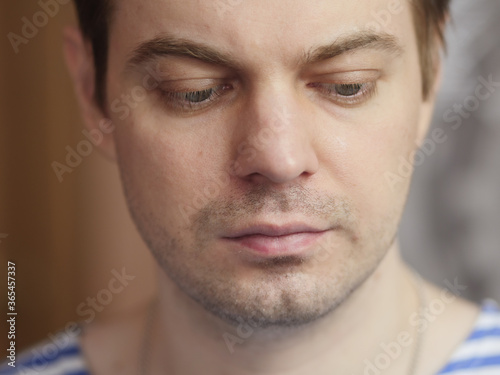 Portrait of pensive man with short hair and no retouch.