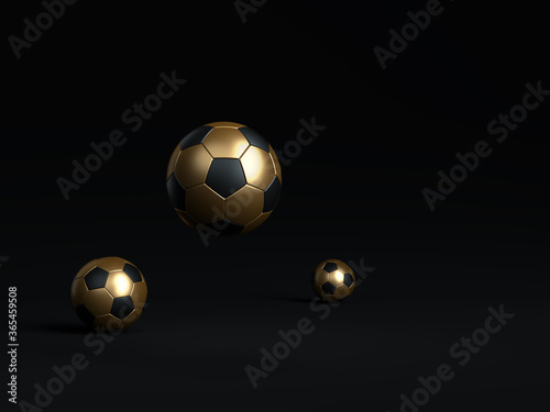 Football balls isolated on black background. Football game minimal black background concept. Soccer balls black and gold color minimalist mock up idea. Black colored dark color isolated image.