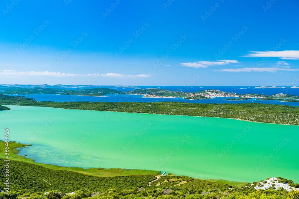 Spectacular landscape on Adriatic sea in Croatia, panoramic view of ornithological nature park Vrana lake (Vransko jezero). Murter archipelago in background.