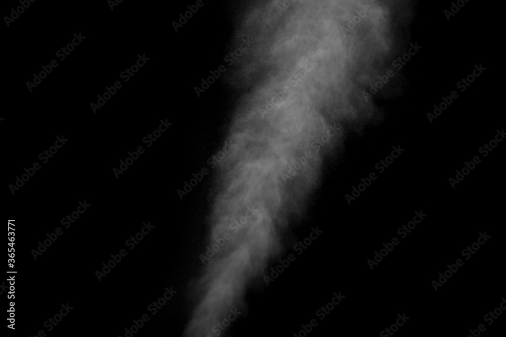 Abstract steam with dots of spray moves on a black background. Figured smoke can be used for design Abstract steam with dots of spray moves on a black background. Figured smoke can be used for design