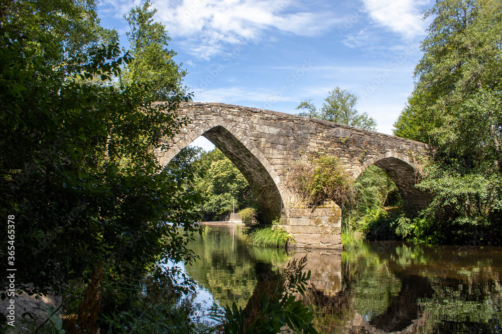 Medieval stone bridge of San Alberte over the river Parga in Lugo Spain