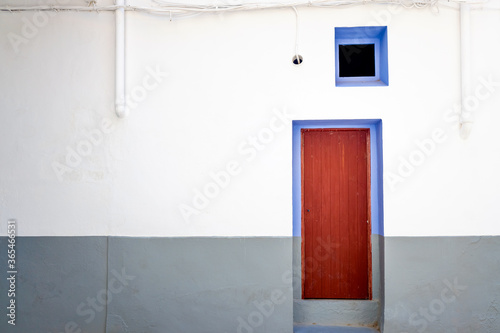 Wall and door of a rural house in a small Mediterranean town. © Joaquin Corbalan