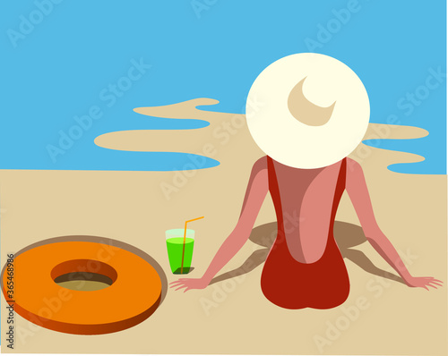 girl who sits on the beach near the ocean under the sun wearing a hat.