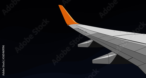 The gray wing of an airplane on a dark blue background.