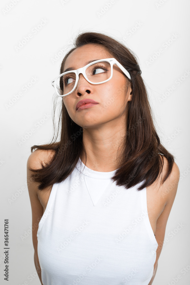 Studio shot of young beautiful Asian woman