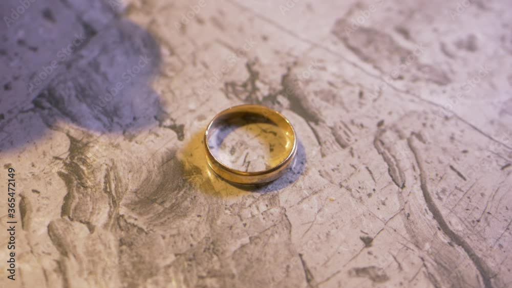Choosing Wedding Ring In Exchange Of Liquor Cap - Marriage Greater Than Alcoholism Concept - close up Choosing Wedding Ring In Exchange Of Liquor Cap - Marriage Greater Than Alcoholism Concept - close up