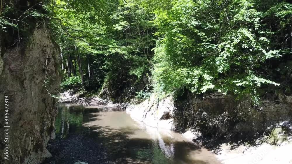 Scenic narrow gorge with river running through. Flying over and down the river. Scenic narrow gorge with river running through. Flying over and down the river.