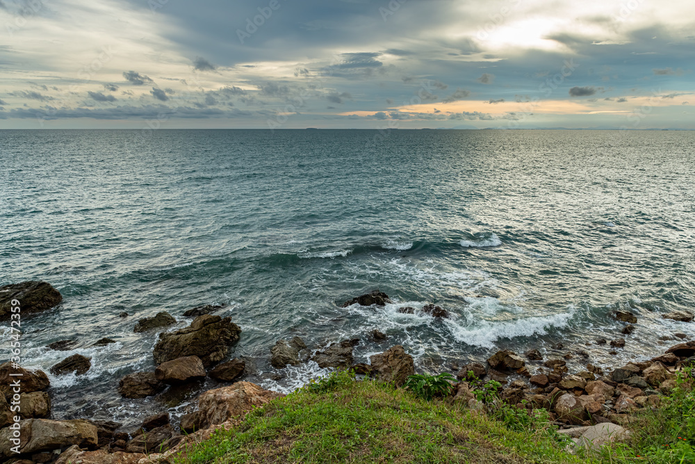 Coastal Sunset, Rocky Coastline with texture of cloudy sky in Chanthaburi province, Thailand