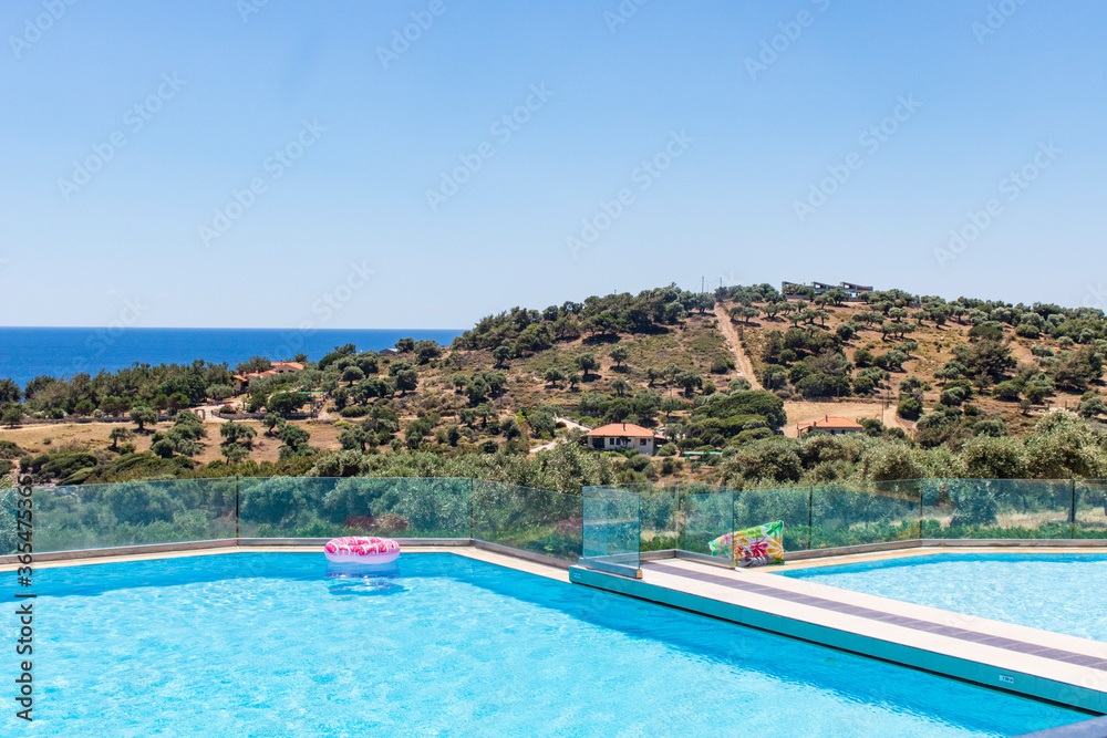 View of swimming pool in hotel resort in Greece