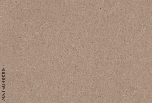 Close up view of textured brown coloured carton paper background. Extra large highly detailed image.