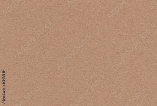 Close up view of textured brown coloured carton paper background. Extra large highly detailed image.