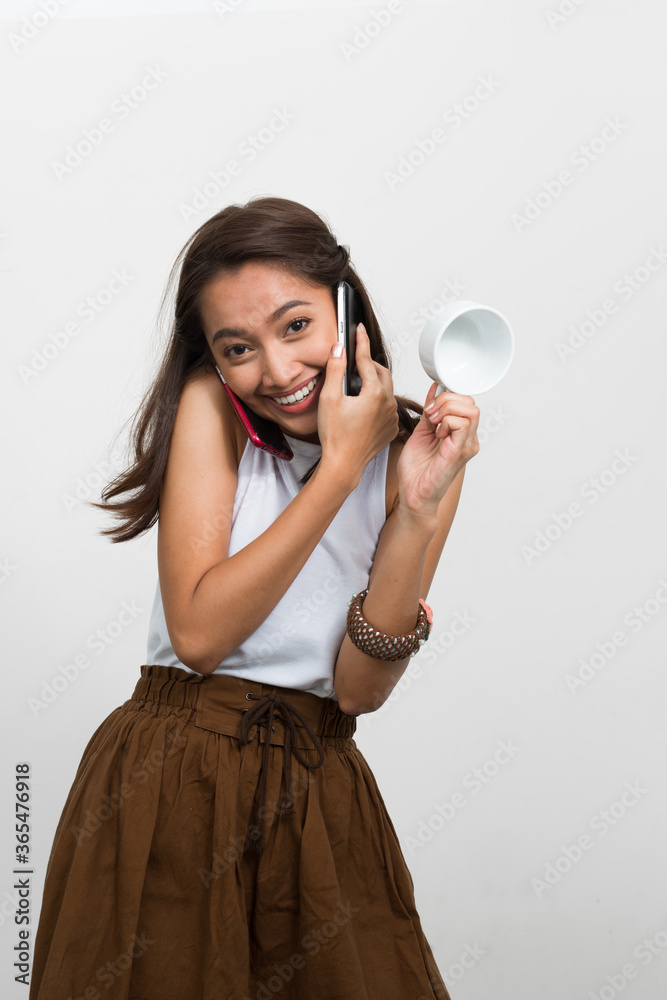 Obraz premium Studio shot of young beautiful Asian woman