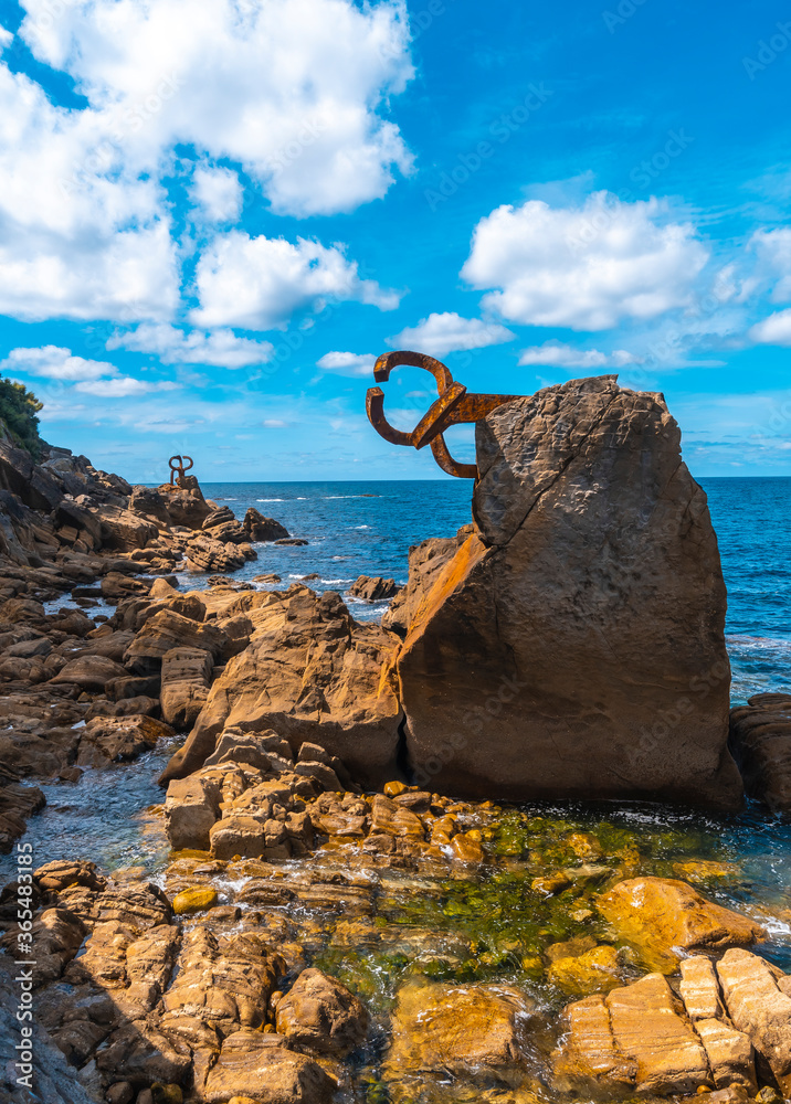 Fototapeta premium Peine del Viento beautiful sculpture in the city of San Sebastian, Gipuzkoa. Basque Country. Sculpture on the ondarreta beach in the Eduardo Chillida neighborhood of Antiguo