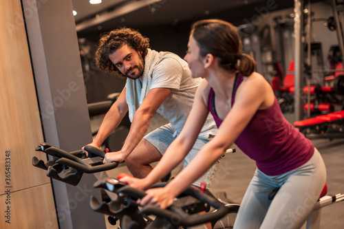 Couple working out in gym