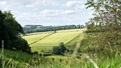 A time-lapse of the Yorkshire Wolds with a view over a sunny green valley - fields and grass in summer photo