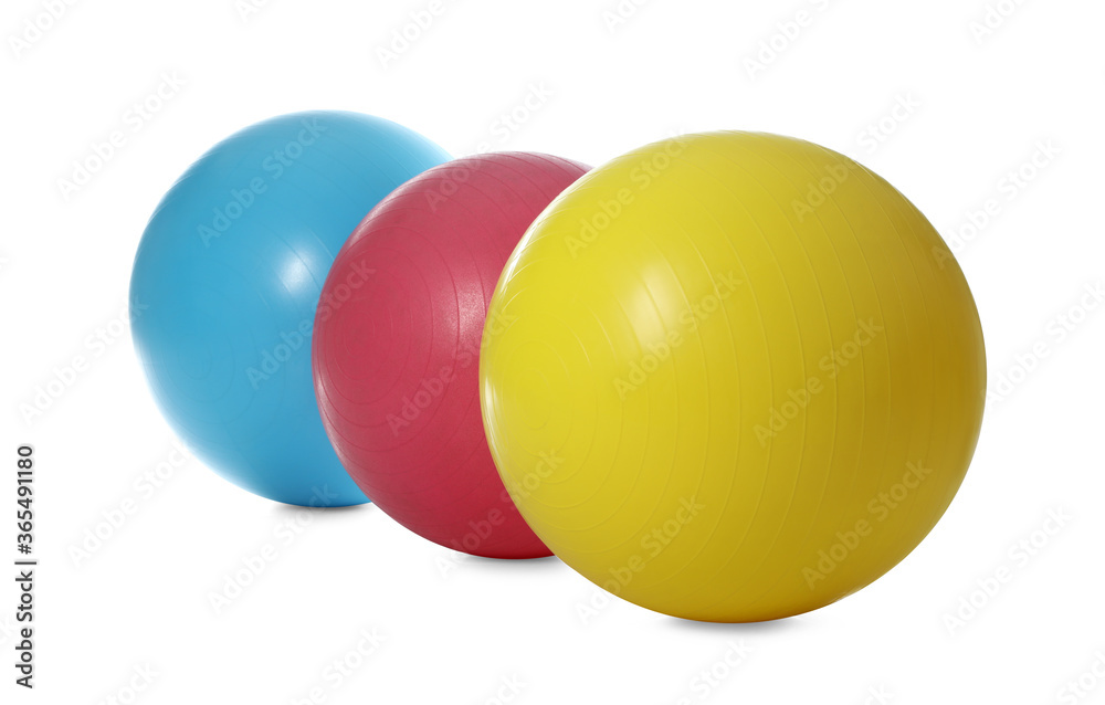 Different colorful fitness balls isolated on white Different colorful fitness balls isolated on white