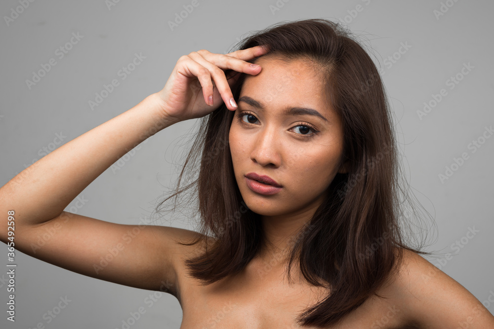 Portrait of young beautiful Asian woman shirtless Portrait of young beautiful Asian woman shirtless