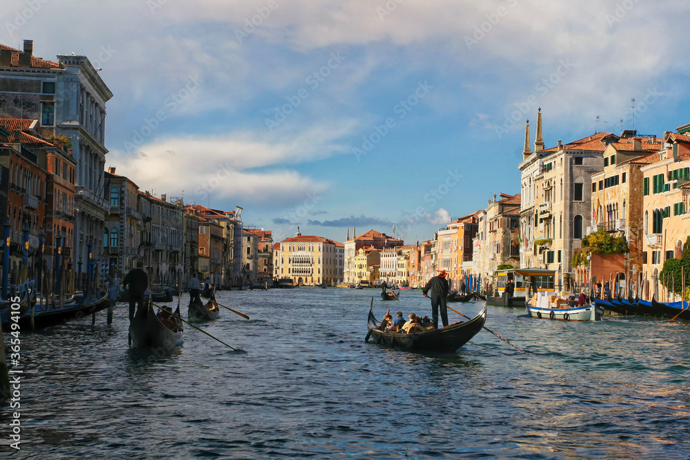 Picturesque cityscape of Venice with tourist on gondolas
