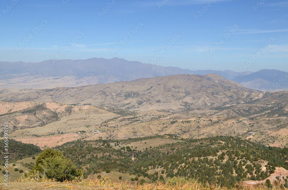 Beautiful landscape, mountains of Uzbekistan. Against the background of mountains and trees. Beldersay.