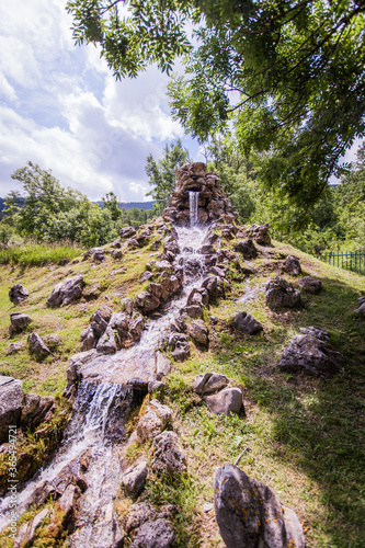 Small waterfall rocks cascade  fresh running water  summer daylight