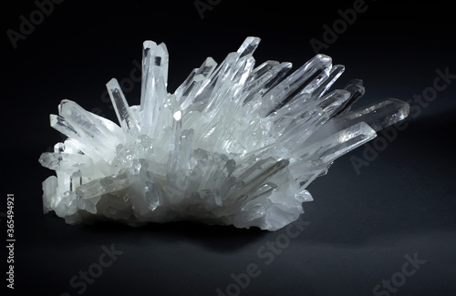 Quartz crystals on a black background.