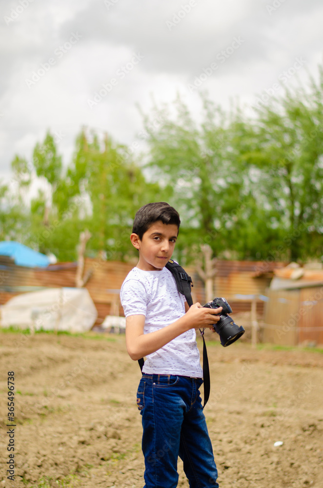 young photographer and boy in white shirt
young photographer and boy in white shirt