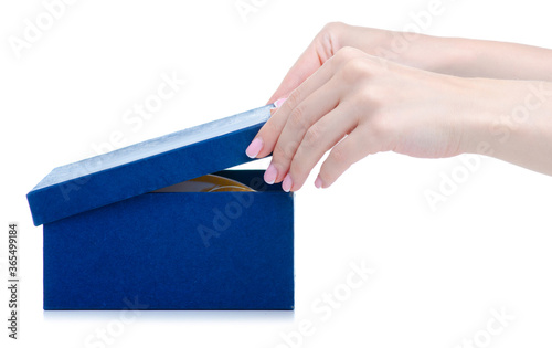 Female hands opens blue box on white background isolation