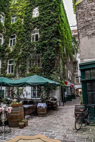 Picturesque Restaurant In The Backyard Of An Old House In The Inner City Of Vienna In Austria