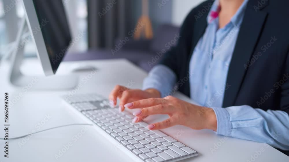Woman in glasses typing on a computer keyboard. Concept of remote work. Woman in glasses typing on a computer keyboard. Concept of remote work.