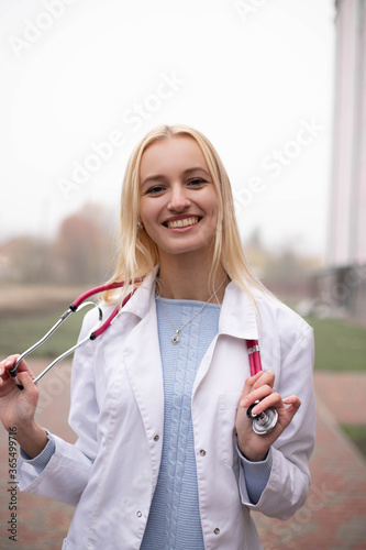 young handsome doctor with a stethoscope around his neck, medical student, interns, security snooth photo