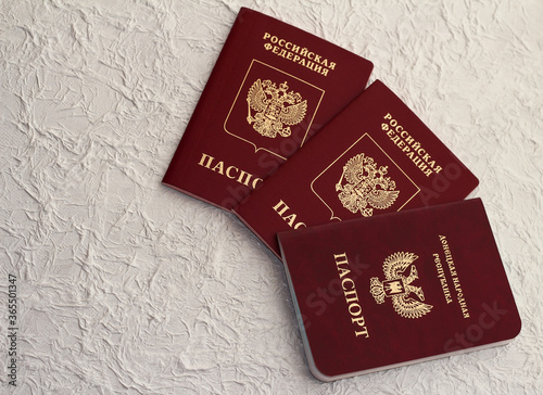 Passport of the Russian Federation and passport of the Donetsk people's Republic . The inscription in Russian: Russian Federation, passport, Donetsk people's Republic photo