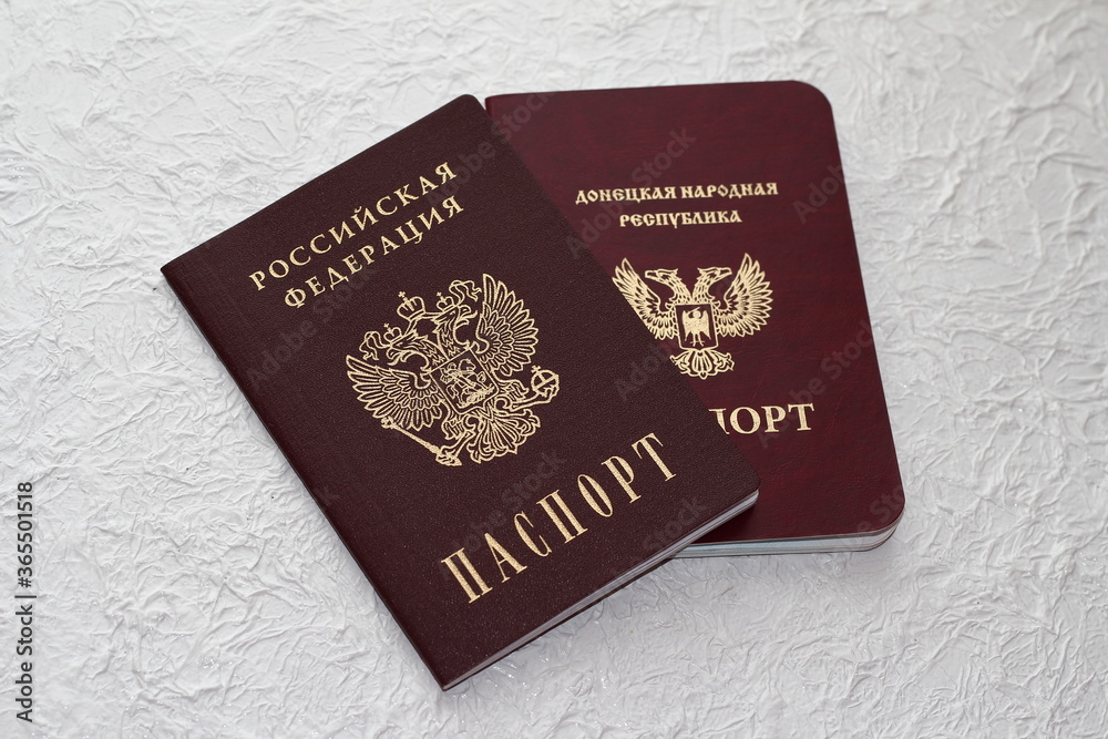 Passport of the Donetsk people's Republic on a white crumpled background. The inscription in Russian: Donetsk people's Republic, passport. Passport of the Donetsk people's Republic on a white crumpled background. The inscription in Russian: Donetsk people's Republic, passport.