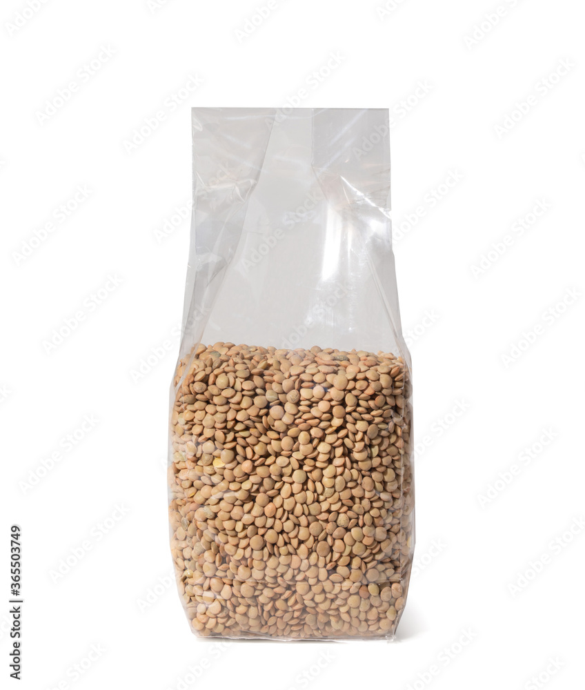 Legumes in Plastic Package, Small Lentils - Close-Up - Isolated on White Background Legumes in Plastic Package, Small Lentils - Close-Up - Isolated on White Background