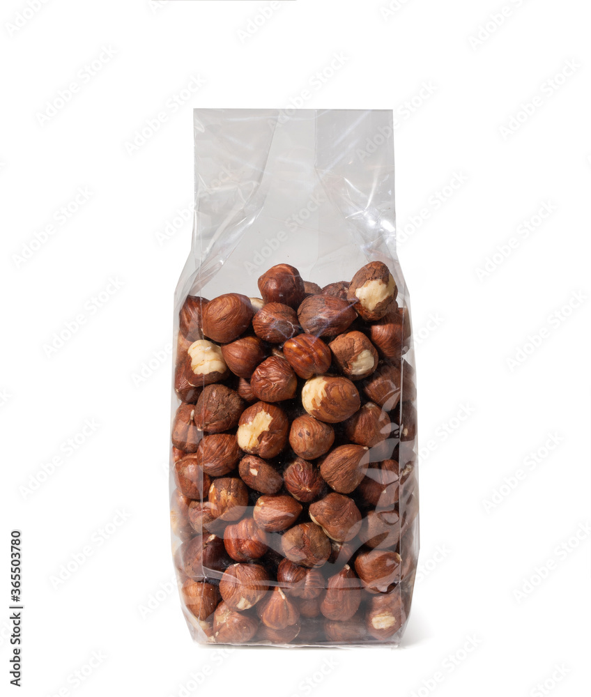 Fototapeta premium Hazelnuts in Plastic Package, without Shell - Close-Up - Isolated on White Background