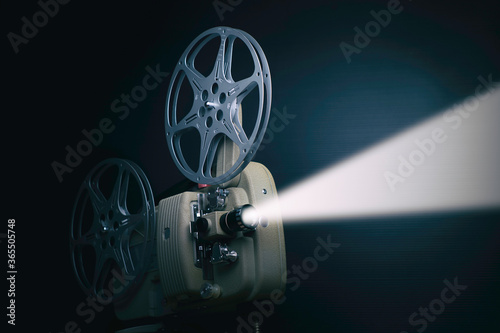 old film projector with stream of light 