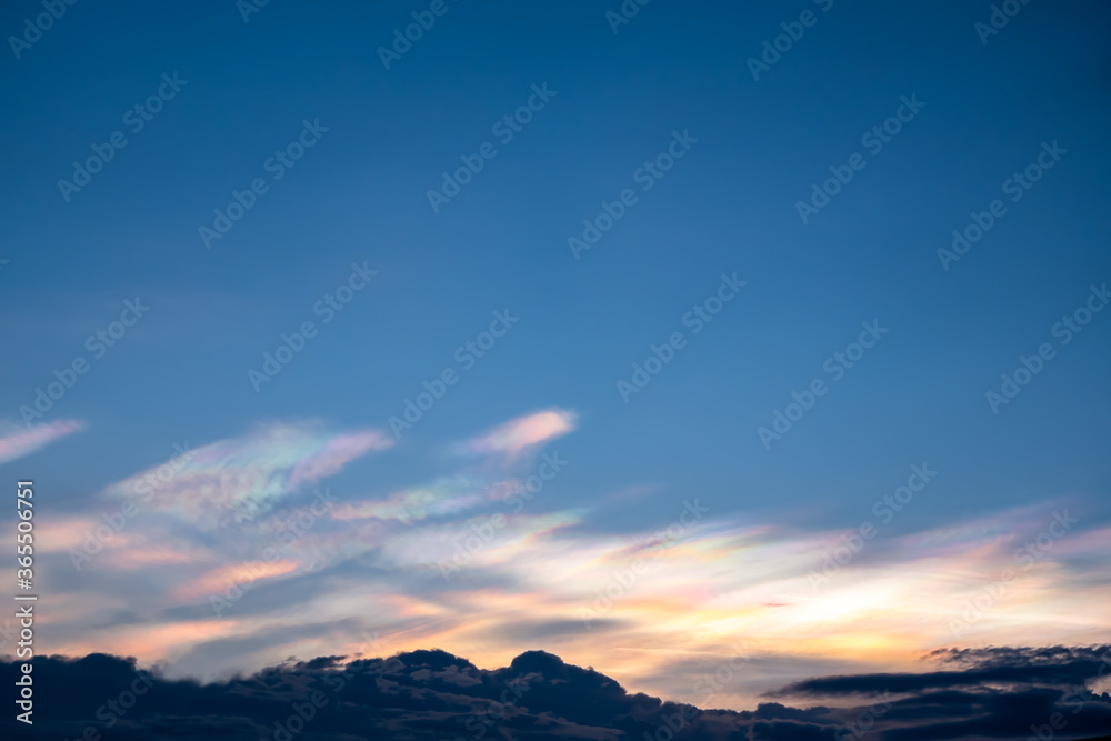Fototapeta premium The beauty of the rainbow clouds Above the black clouds in the evening.